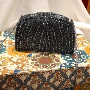 Small beaded bag with rope shoulder strap